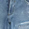 Blå vintage-slitna snickarjeans
