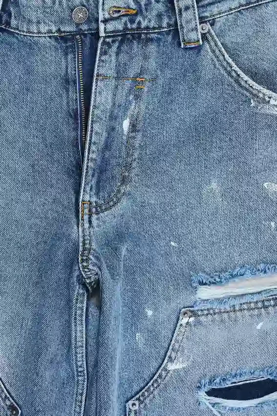 Blå vintage-slitna snickarjeans