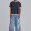 Blå vintage-slitna snickarjeans