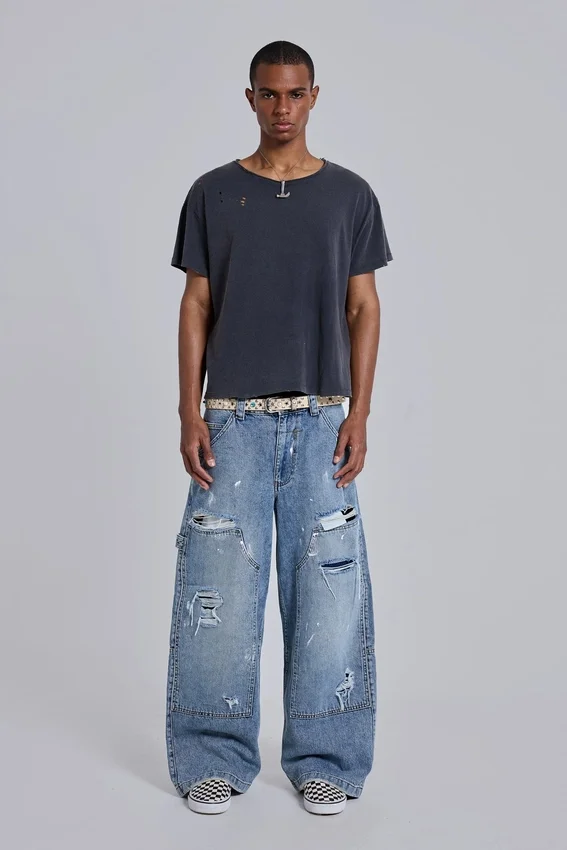 Blå vintage-slitna snickarjeans