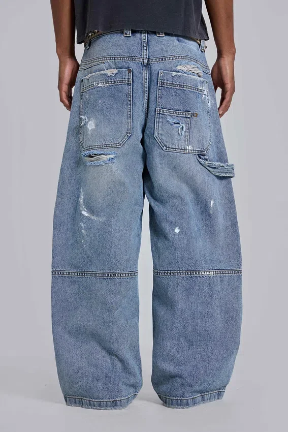 Blå vintage-slitna snickarjeans