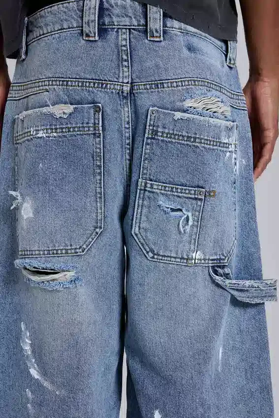 Blå vintage-slitna snickarjeans