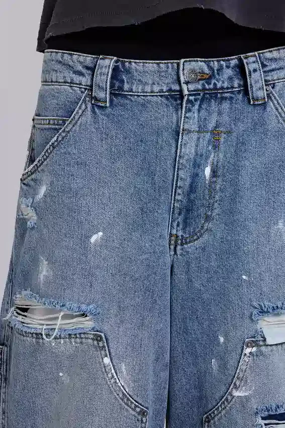 Blå vintage-slitna snickarjeans