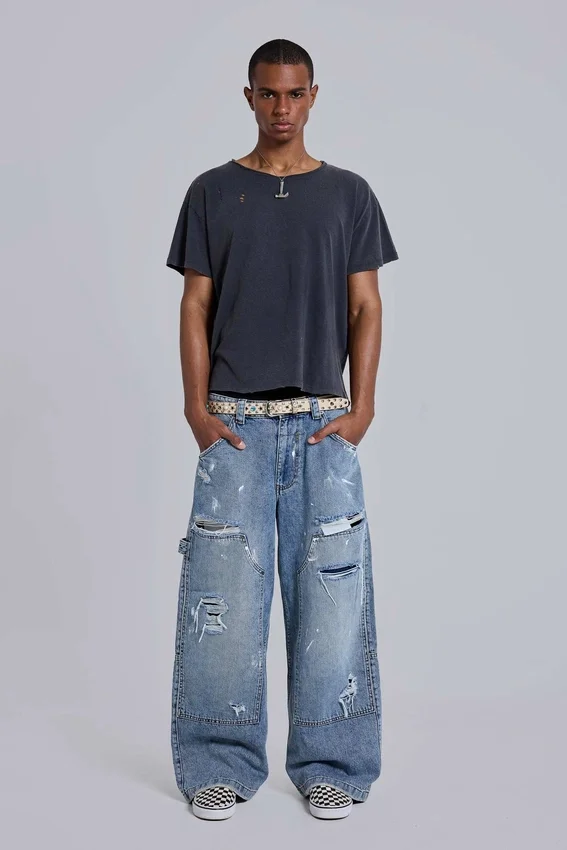 Blå vintage-slitna snickarjeans