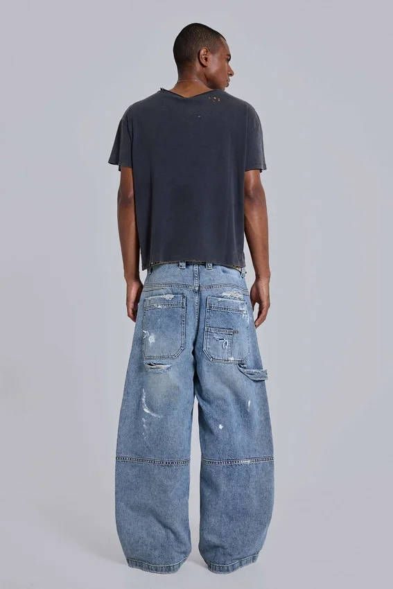 Blå vintage-slitna snickarjeans