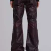 Burgundyfärgade bootcut-byxor i imitationsläder med nitar