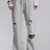 Cleo slitna, avslappnade joggingsbyxor med bootcut-passform