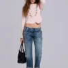 Cooper-jeans med dekorationer i kort modell