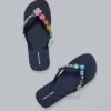 Flip-flops med smyckesberlocker