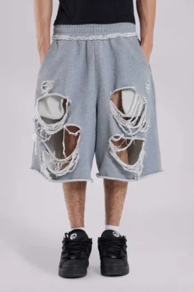 Gråa, slitna Monster-shorts
