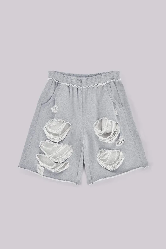 Gråa, slitna Monster-shorts