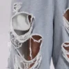Gråa, slitna Monster-shorts