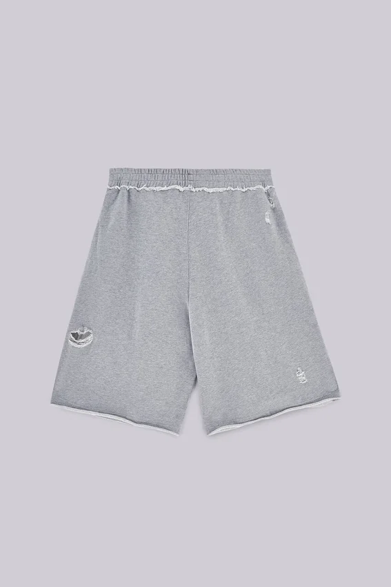 Gråa, slitna Monster-shorts