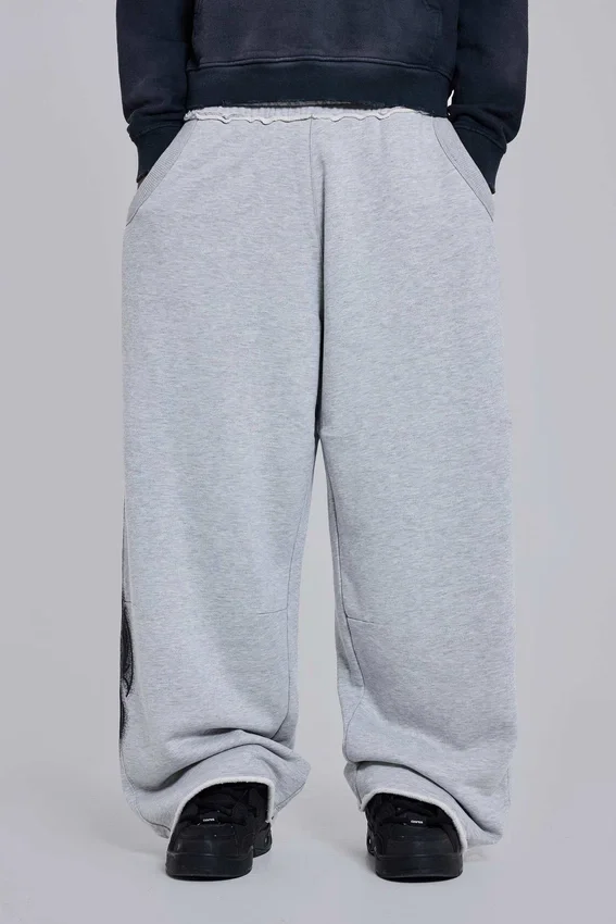 Gråmelerade, baggy Monster Joggers med gotiskt tryck