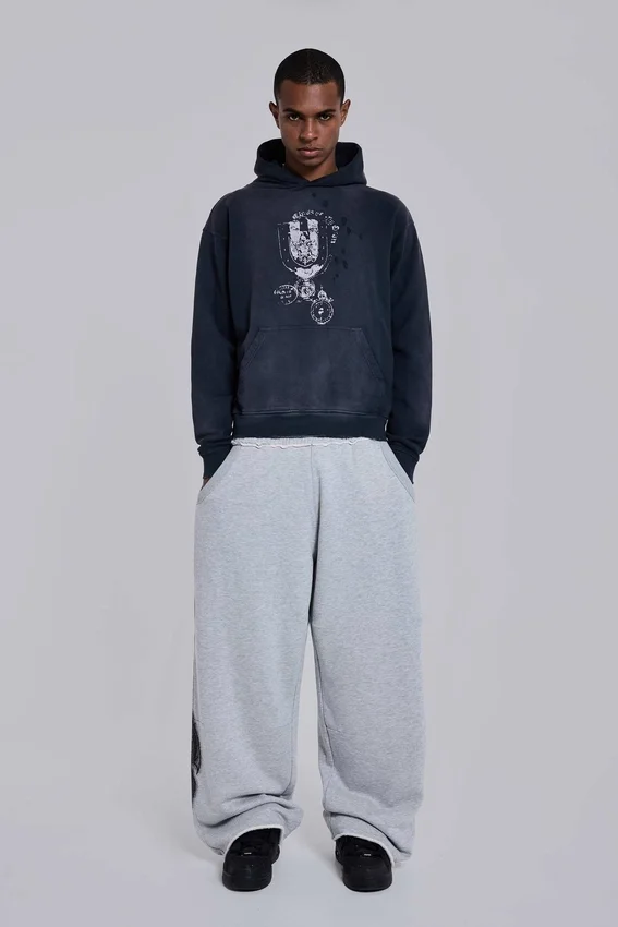 Gråmelerade, baggy Monster Joggers med gotiskt tryck