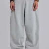 Gråmelerade, baggy Monster Joggers med uppvikt nederkant