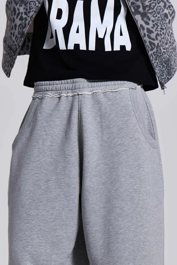 Gråmelerade, baggy Monster Joggers med uppvikt nederkant