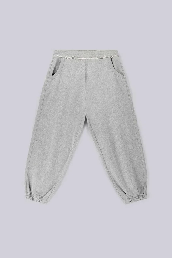 Gråmelerade, baggy Monster Joggers med uppvikt nederkant