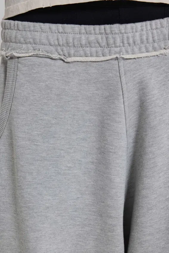 Gråmelerade, baggy Monster Joggers med uppvikt nederkant