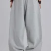Gråmelerade, baggy Monster Joggers med uppvikt nederkant