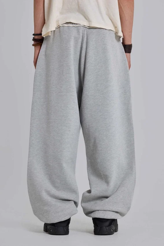 Gråmelerade, baggy Monster Joggers med uppvikt nederkant