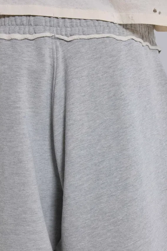Gråmelerade, baggy Monster Joggers med uppvikt nederkant