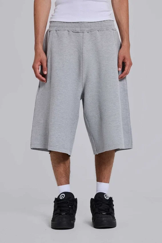 Gråmelerade joggingshorts i waffelväv med Monster-motiv
