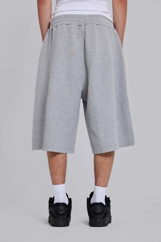 Gråmelerade joggingshorts i waffelväv med Monster-motiv