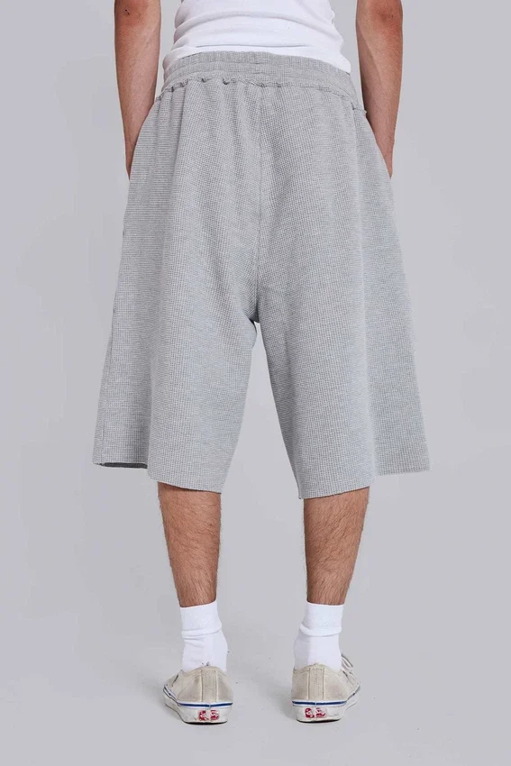 Gråmelerade joggingshorts i waffelväv med Monster-motiv