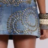 Hena-minikjol i denim med nitar