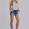 Hena-minikjol i denim med nitar