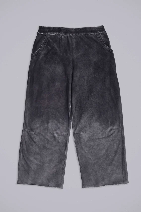 Joggingbyxor med nitar och vinge-mönster