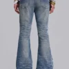 Mellblå slitna, skrynkliga Drift-Jeans med utsvängda ben