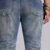 Mellblå slitna, skrynkliga Drift-Jeans med utsvängda ben