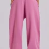 Rosa, vidbyxor med uppvikt benslut i Monster Joggers-stil