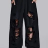 Slitna svarta, baggy Monster Joggers
