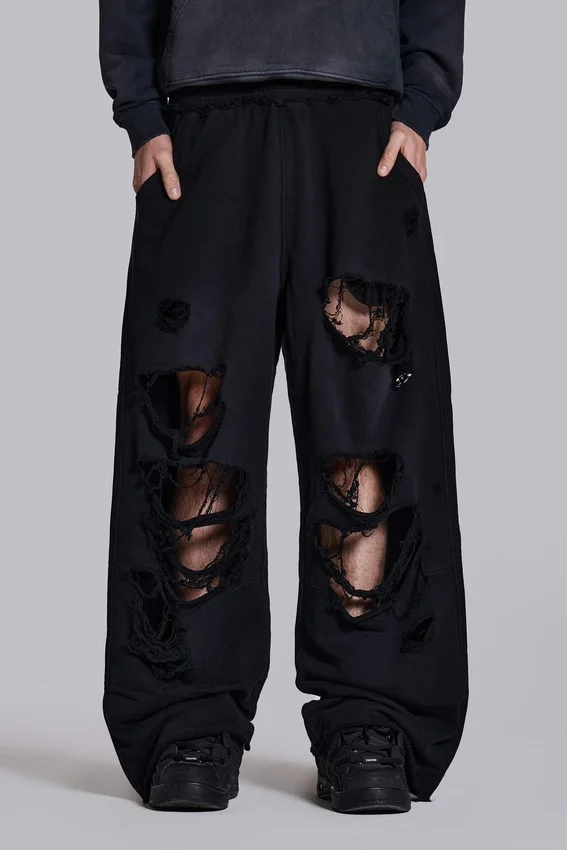 Slitna svarta, baggy Monster Joggers