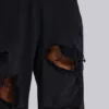 Slitna svarta, baggy Monster Joggers