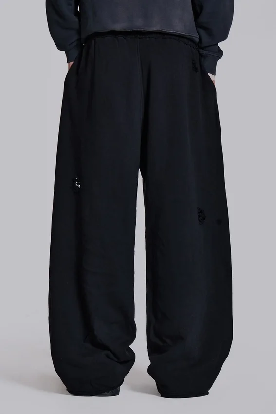 Slitna svarta, baggy Monster Joggers