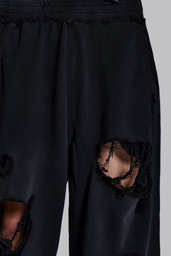 Slitna svarta, baggy Monster Joggers