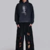 Slitna svarta, baggy Monster Joggers