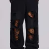 Slitna svarta, baggy Monster Joggers