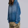 Solblekt hoodie i våffelväv med nitar