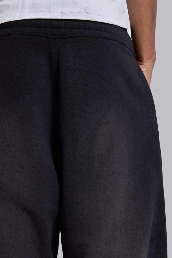 Svarta, baggy Monster Joggers med uppvikt nederkant