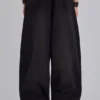 Svarta, baggy Monster Joggers med uppvikt nederkant