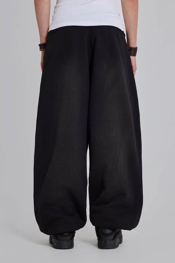 Svarta, baggy Monster Joggers med uppvikt nederkant