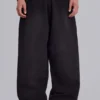 Svarta, baggy Monster Joggers med uppvikt nederkant