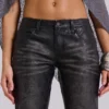 Svarta Cooper-jeans i PU med utsvängda ben