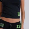 Svarta fotbollsminishorts nr 13