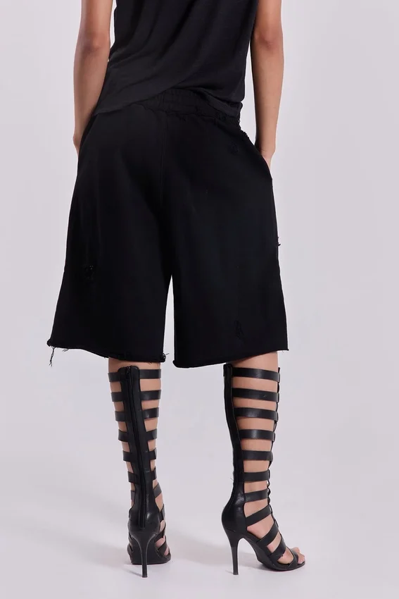 Svarta slitage-behandlade Monster-shorts